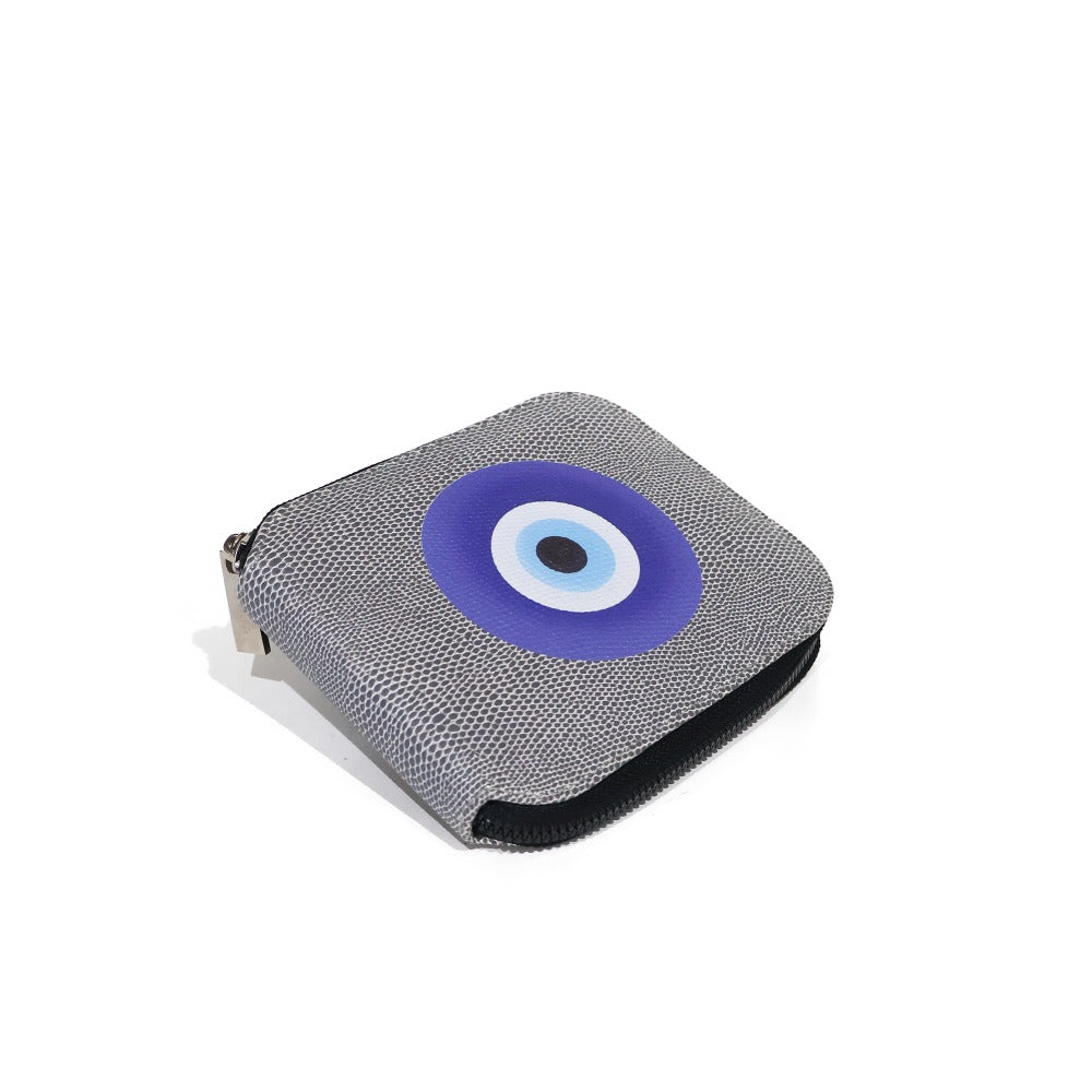 PORTA ACEITES DE VIAJE REPTIL GRIS OJO AZUL