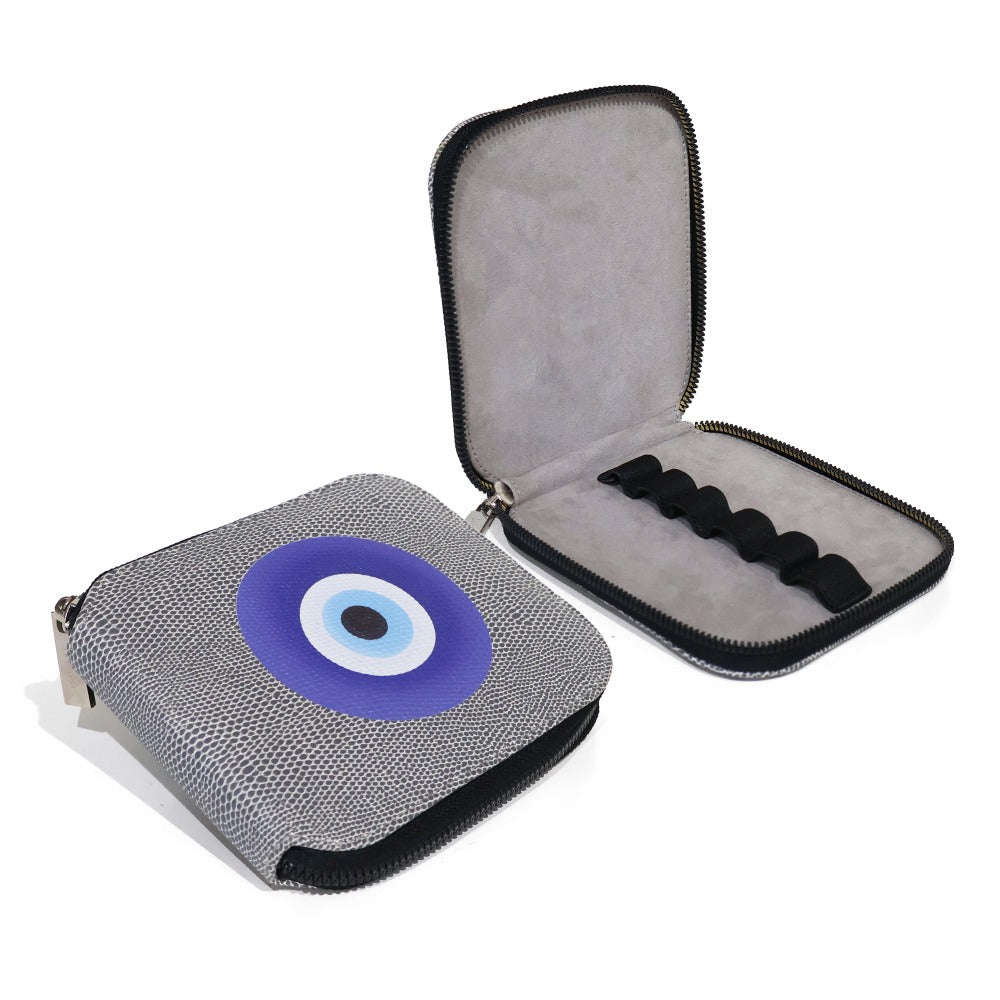 PORTA ACEITES DE VIAJE REPTIL GRIS OJO AZUL