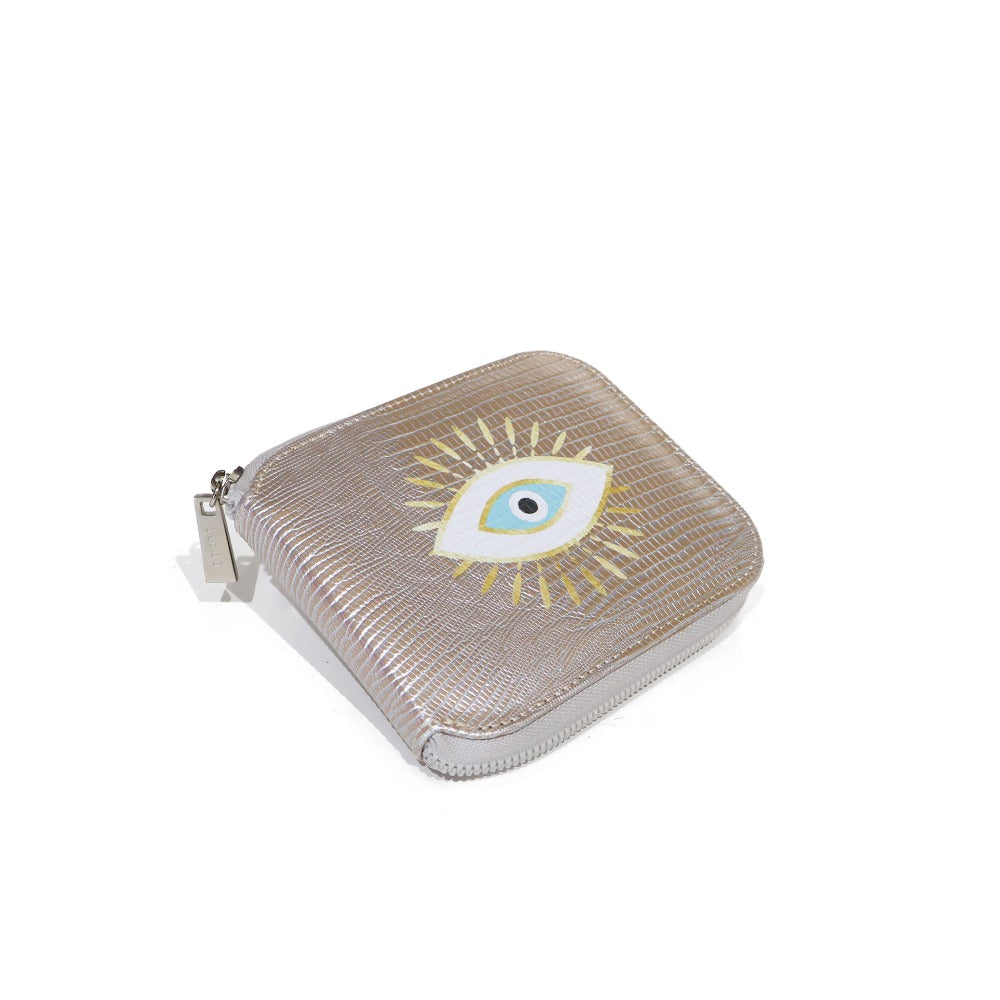 PORTA ACEITES DE VIAJE TEJUS PLATA BEIGE OJO DORADO